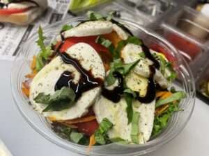 Mixed greens salad with fresh mozzarella